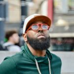 a man with a beard wearing sunglasses and a hat